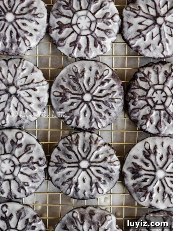 Classic Snickerdoodle Cookie Recipe: Soft Cinnamon Sugar Cookies 12 Glazed oreo snowflake cookies on a wire cooling rack.