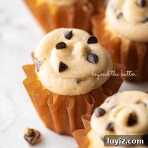 Chocolate Chip Cookie Dough Cupcakes Recipe with Gooey Centers 21 Small batch chocolate chip cookie dough cupcakes on a white marbled background.