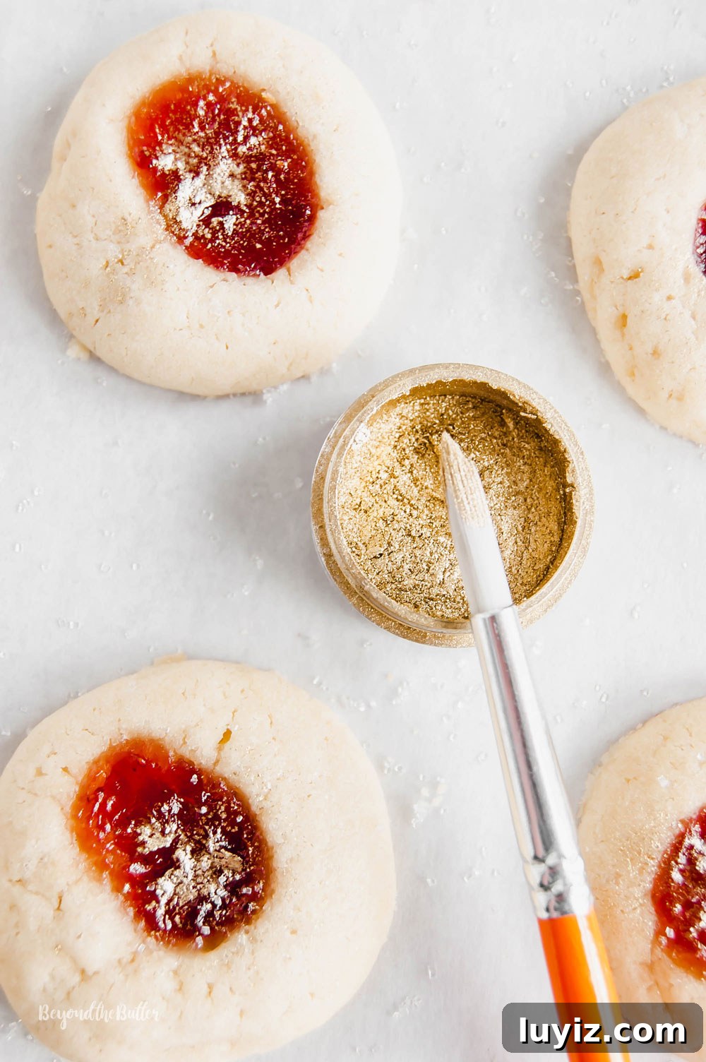 Holiday Jamboree Cookie Recipes for Festive Baking 3 Holiday Jamboree Cookies - jamboree cookies being sprinkled with gold using a brush