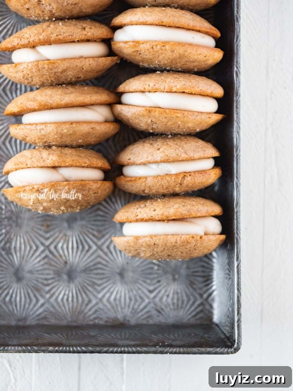 Gingerbread Whoopie Pies Recipe: Soft Molasses Sandwich Cookies 13 Rows of apple cider whoopie pies in vintage baking pan.