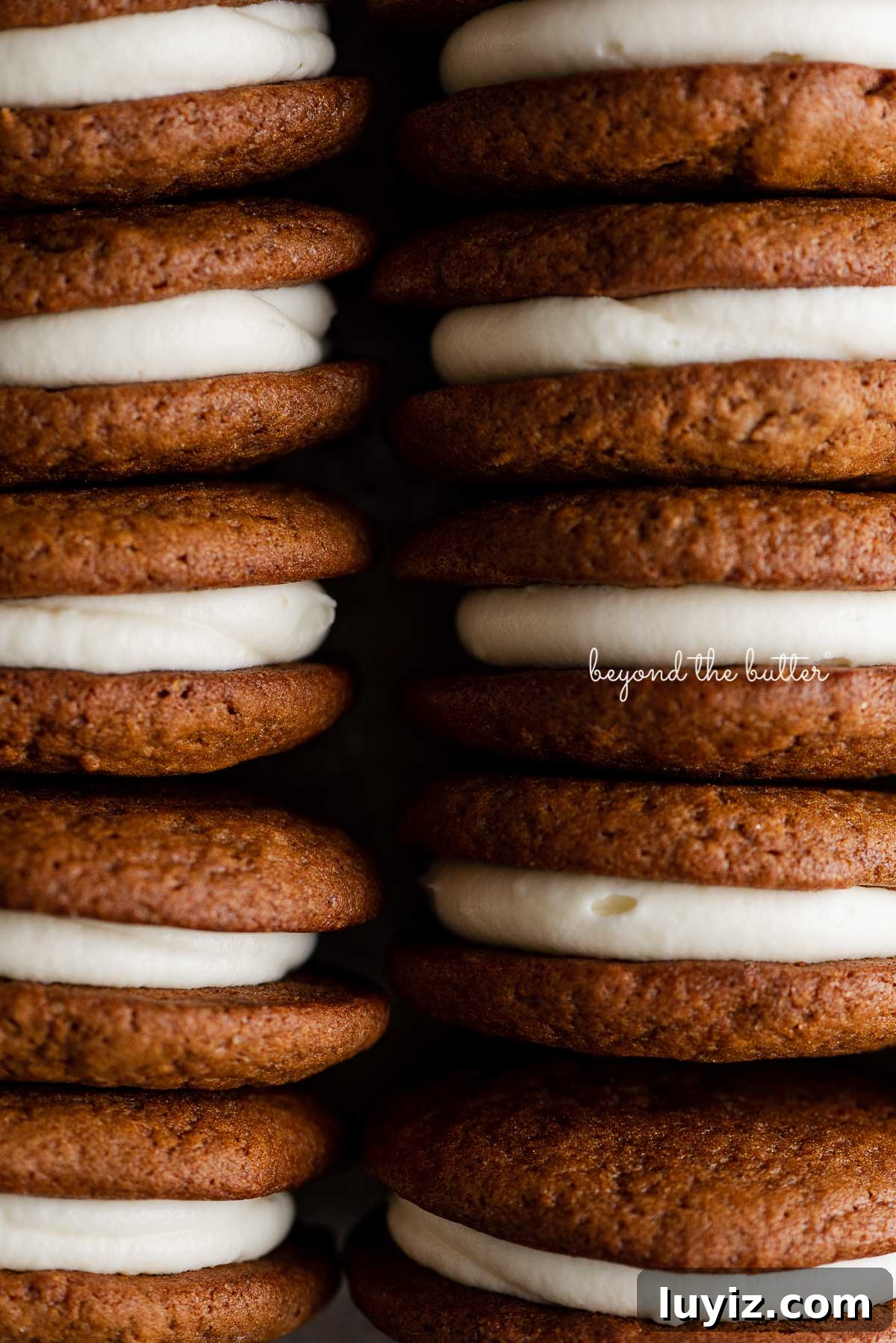 Gingerbread Whoopie Pies Recipe: Soft Molasses Sandwich Cookies 9 Stacked homemade gingerbread whoopie pies filled with cream cheese frosting | © Beyond the Butter®