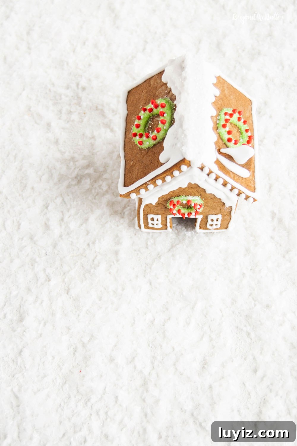 DIY Gingerbread Houses: Step-by-Step Guide for Festive Creations 3 Homemade Gingerbread Houses - Overlooking the roof of one gingerbread house with wreaths on each side | All Images © Beyond the Butter, LLC