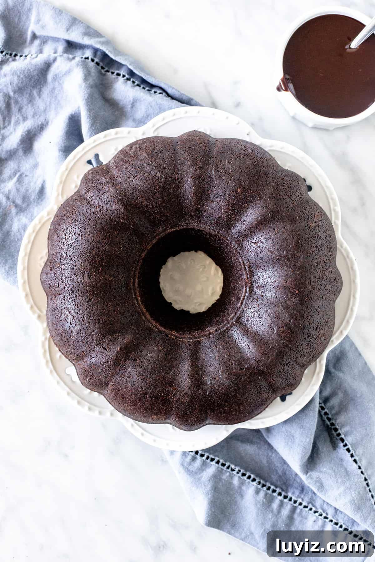 Decadent Chocolate Pound Cake Recipe for Moist, Rich Loaves 4 Chocolate cake made in a bundt pan on a plate.