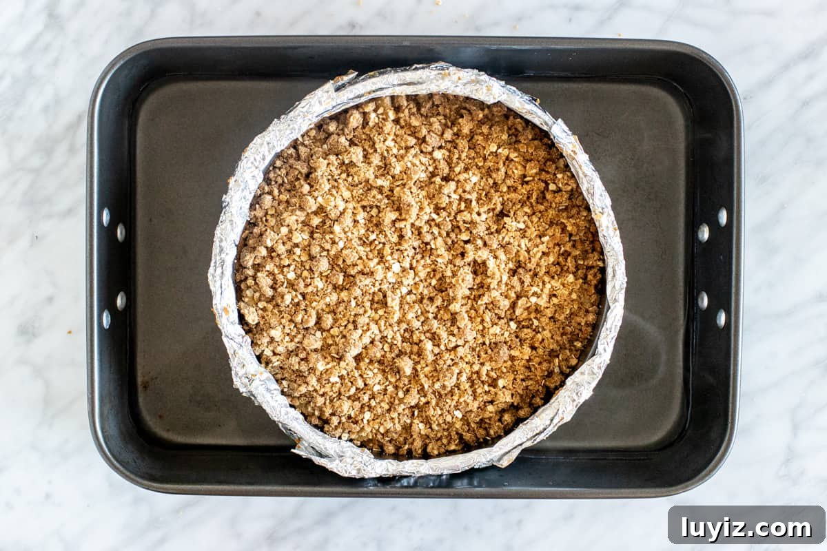 Apple Crisp Cheesecake Recipe with Cinnamon Streusel Topping 5 Unbaked cheesecake in a water bath