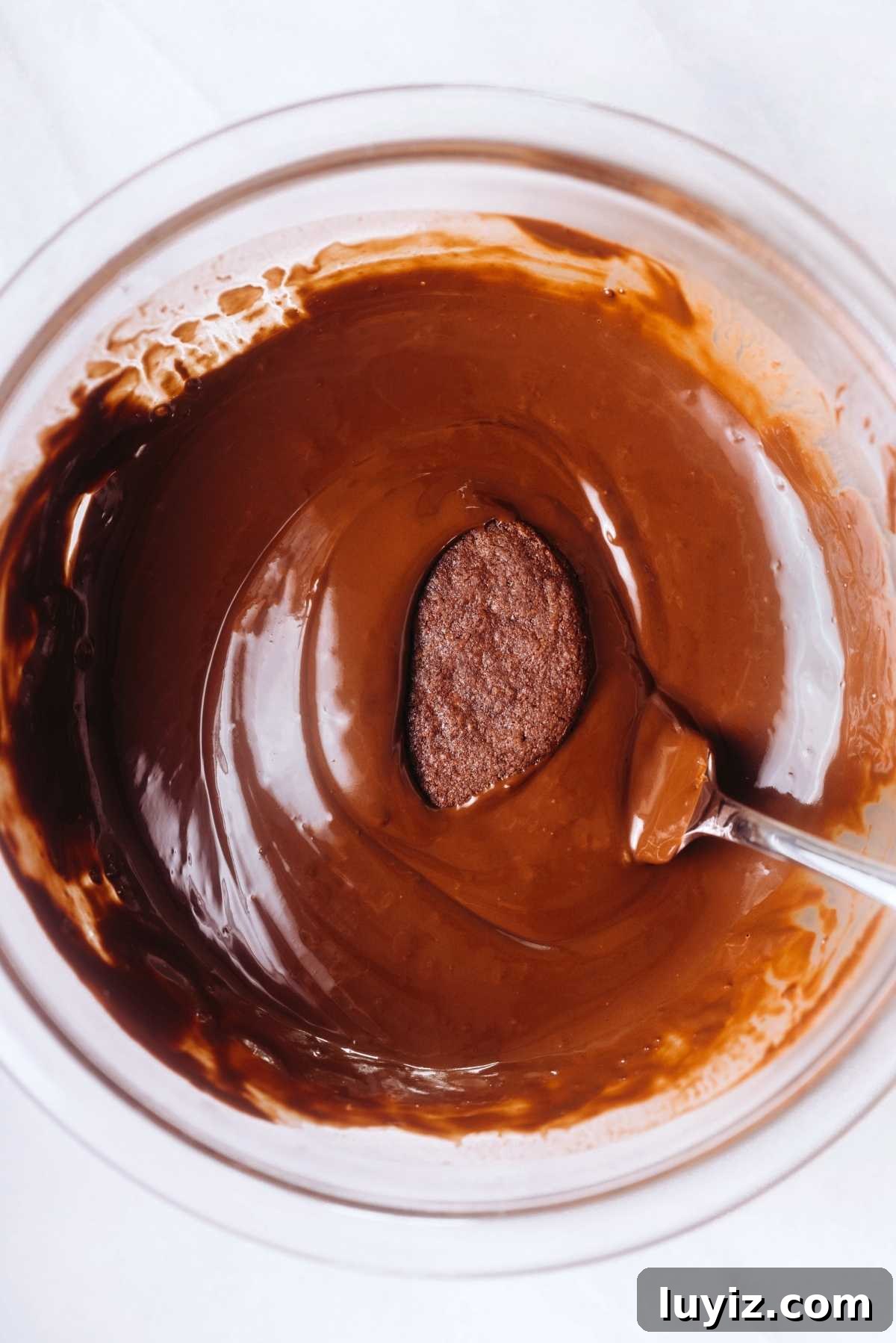 Homemade Thin Mints Recipe: Crisp Chocolate Mint Cookies 12 Dipping thin mint cookies into melted chocolate using a fork.
