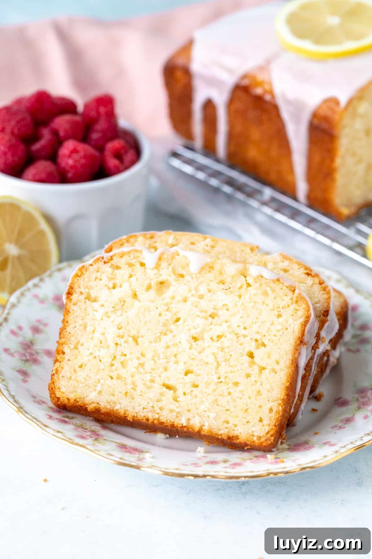 Super Moist Lemon Loaf with Bright Glaze 6 Small plate with slices of lemon loaf cake