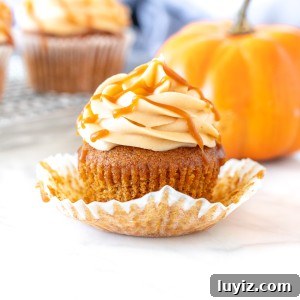 Pumpkin cupcake with caramel buttercream and a decorative pumpkin