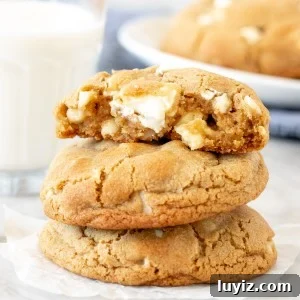 3 white chocolate chunk cookies, stacked on top of each other
