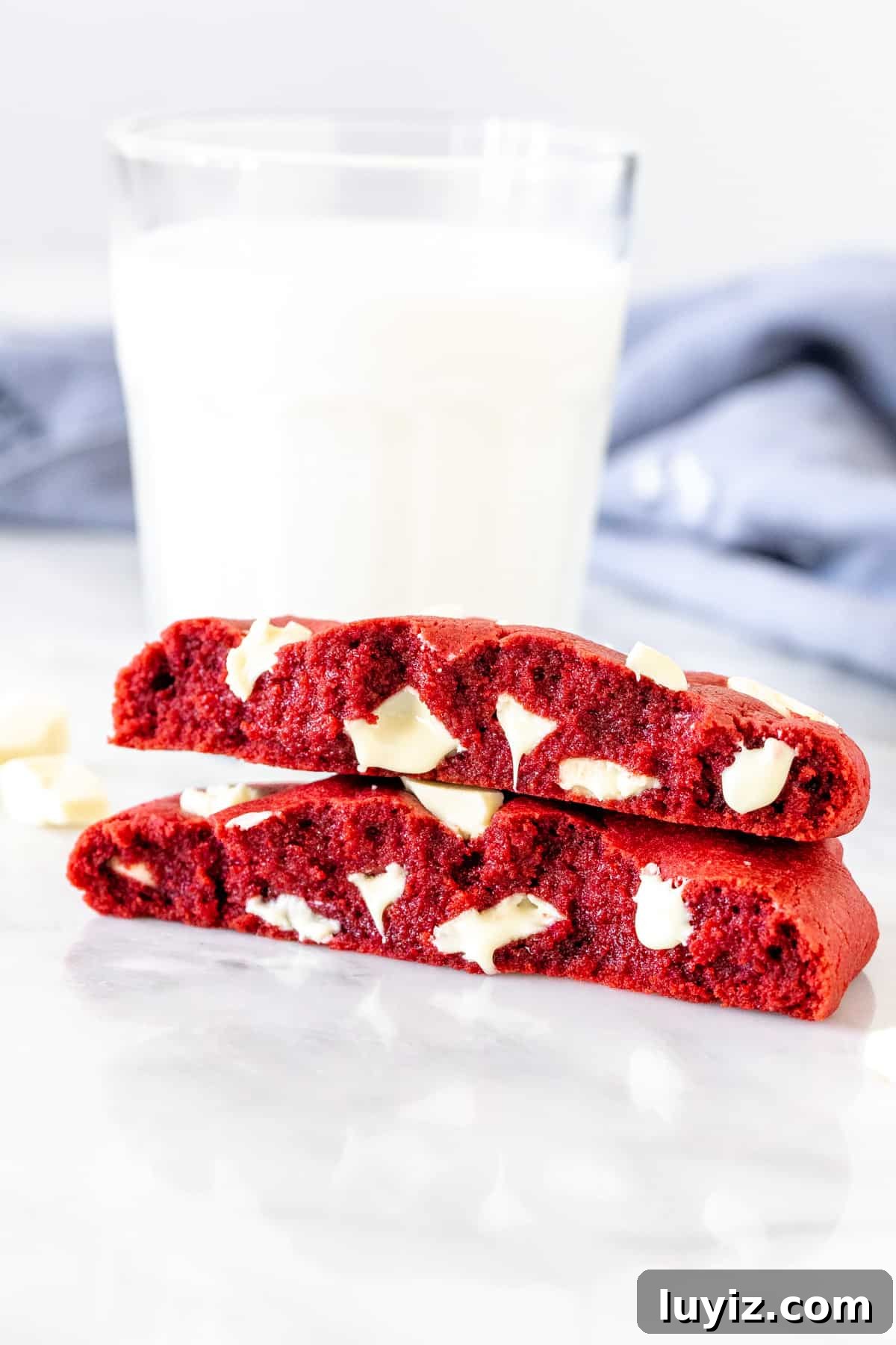 Single-Serve Red Velvet Cookie Recipe: Quick Oven or Microwave Treat 4 Single serving red velvet cookie, broken in half with a glass of milk