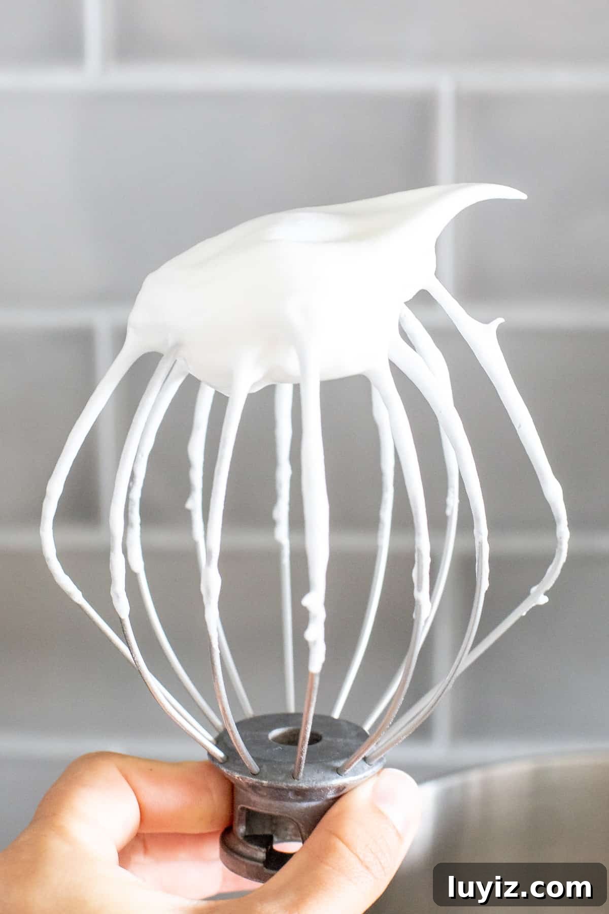 Moist Eggnog Bundt Cake Recipe Perfect for Christmas 3 Whisk attachment of electric mixer with whipped egg whites