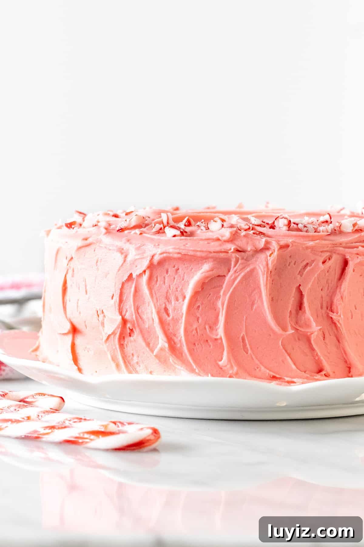 Candy Cane Cake with White Chocolate Peppermint Frosting 2 Candy cane cake with pink peppermint frosting