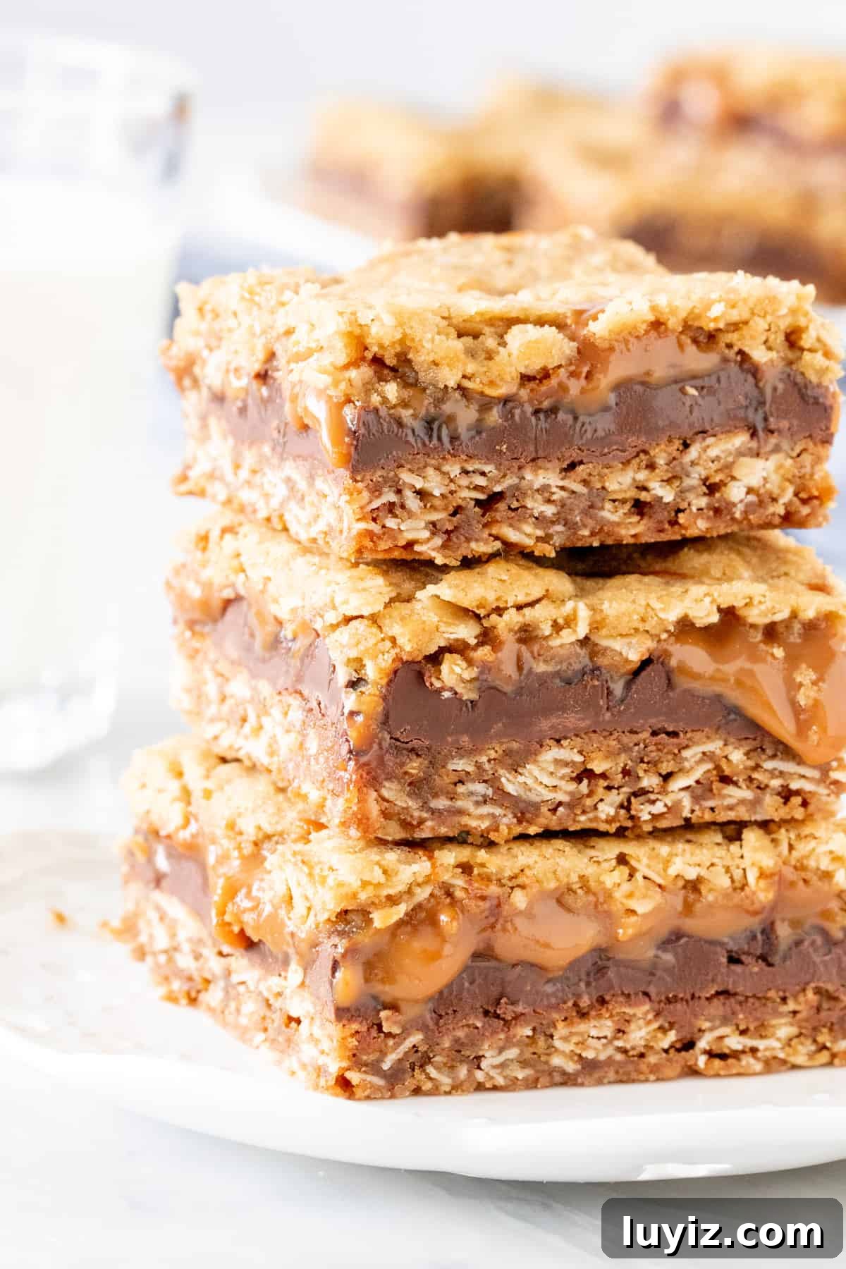Caramelitas: Chewy Caramel Oatmeal Bars Recipe 2 Stack of 2 caramel oatmeal bars with a glass of milk