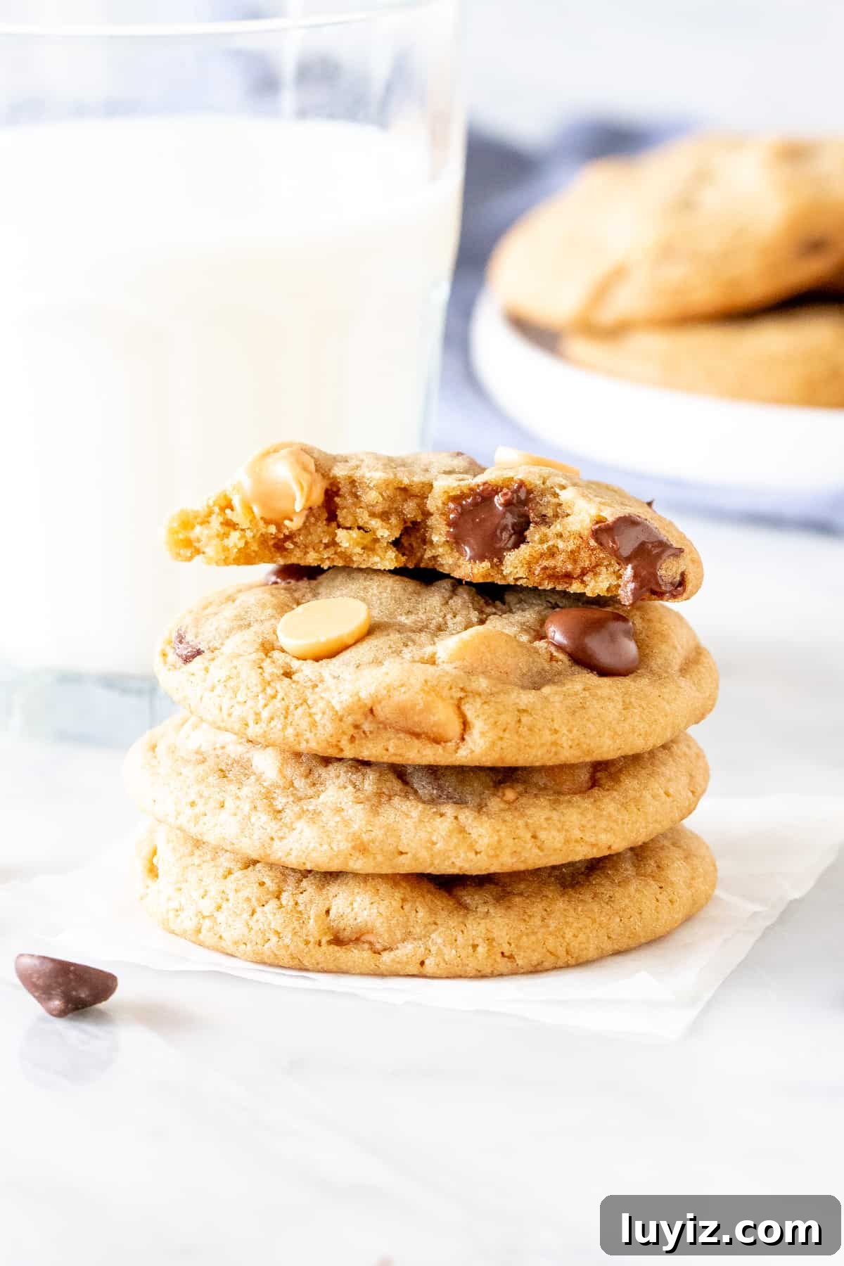 Butterscotch Chocolate Chip Cookies — Soft, Chewy & Gooey 2 Stack of butterscotch chocolate chip cookies with glass of milk
