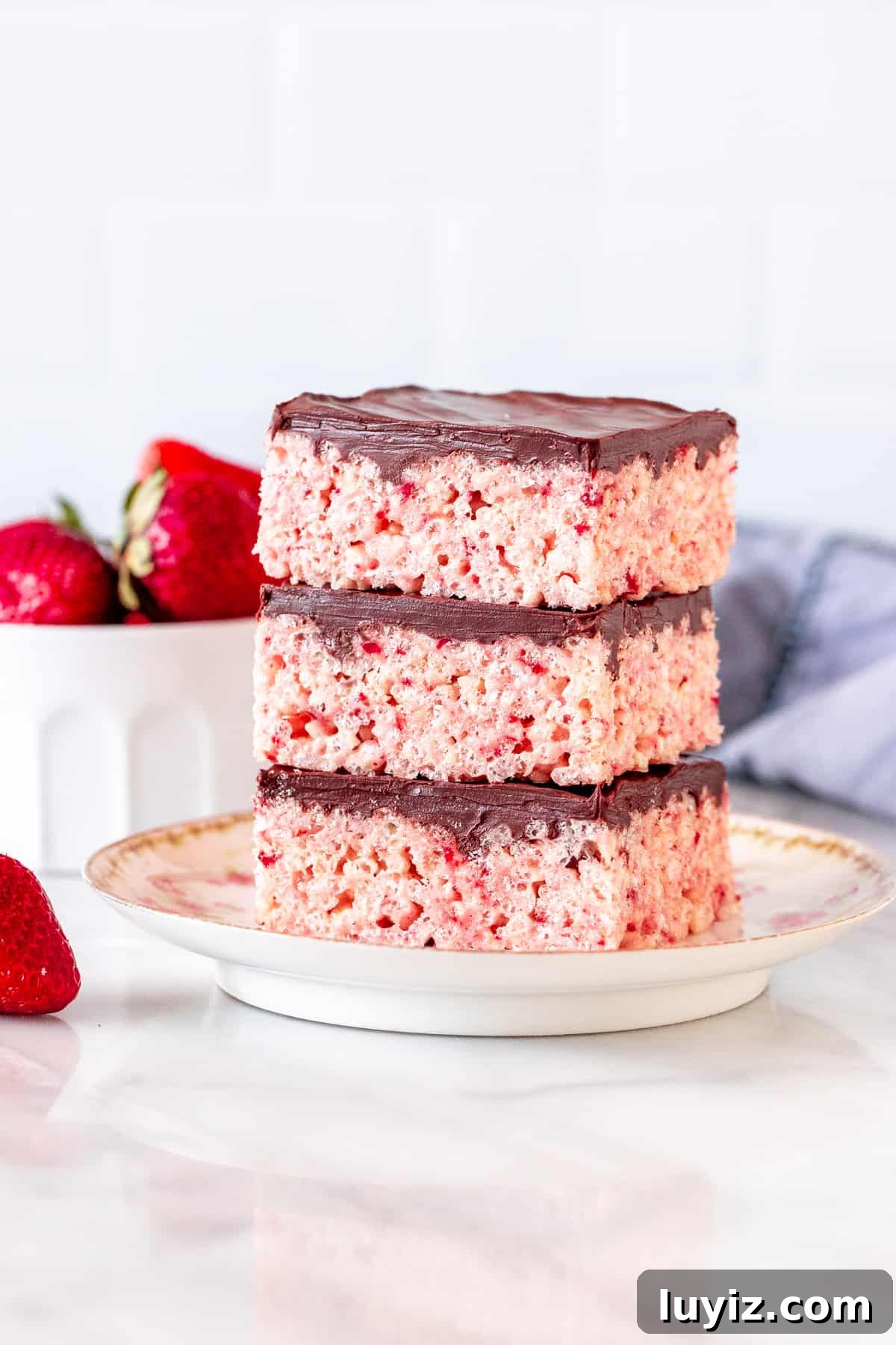 Strawberry Rice Krispie Treat Recipe: Fresh, Fruity Marshmallow Bars 2 Stack of 3 strawberry rice krispie treats with chocolate topping