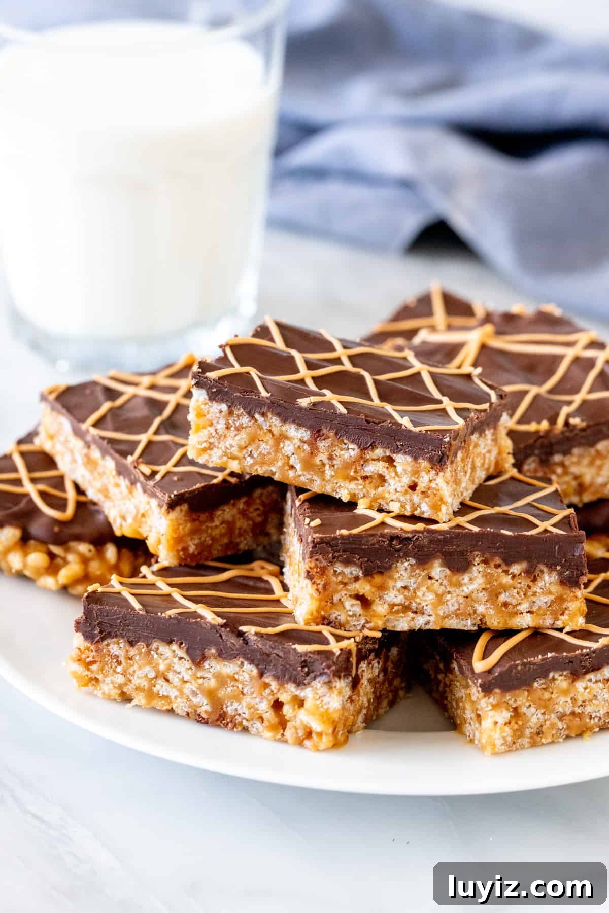 Butterscotch Tiger Bars: Crispy Rice Krispie Treats 3 Plate of butterscotch Rice Krispie treats with chocolate on top