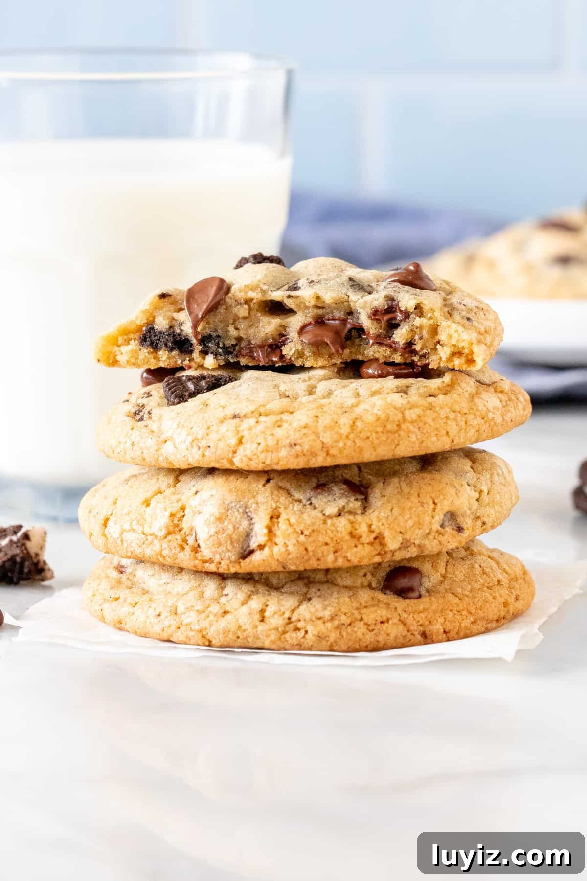 Oreo Chocolate Chip Cookies Recipe — Chewy Cookies with Oreo Pieces 7 Stack of chocolate chip cookies made with Oreo chunks.