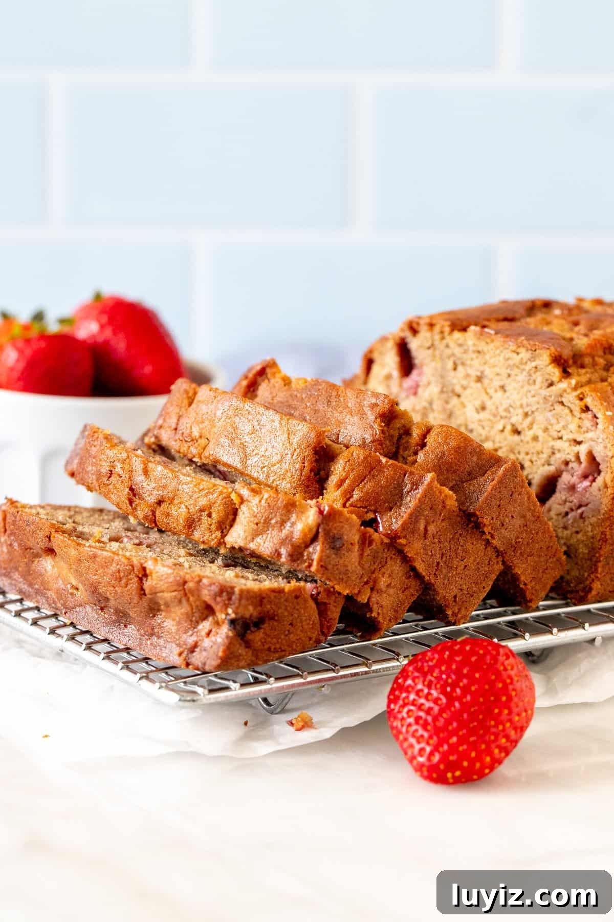 Moist Strawberry Banana Bread with Fresh Fruit Swirls 2 Strawberry banana bread with half the loaf sliced