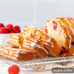 Moist Raspberry Bread Packed with Fresh Berries 6 Raspberry bread with 3 slices cut on a cooling rack