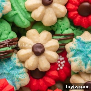Crisp Butter Spritz Cookies: Traditional Holiday Recipe 12 Pile of decorated buttery classic spritz cookies.