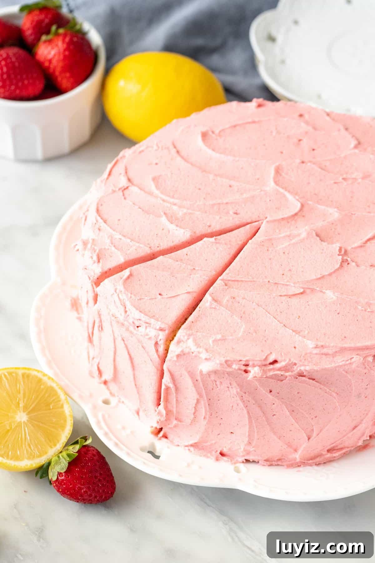Strawberry Lemonade Layer Cake Recipe — Fresh Summer Dessert 4 Round layer cake with strawberry frosting