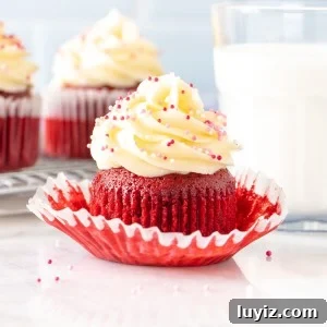 Red velvet cupcake with glass of milk