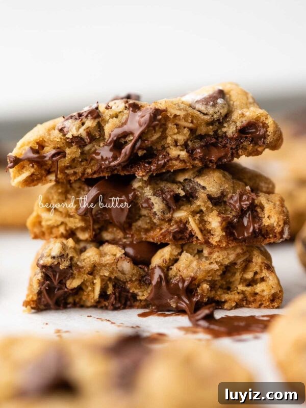 Moist Chocolate Chip Ricotta Cake Recipe for Perfect Dessert 9 Stack of three oatmeal chocolate chip salted caramel cookies on a parchment paper lined baking sheet.