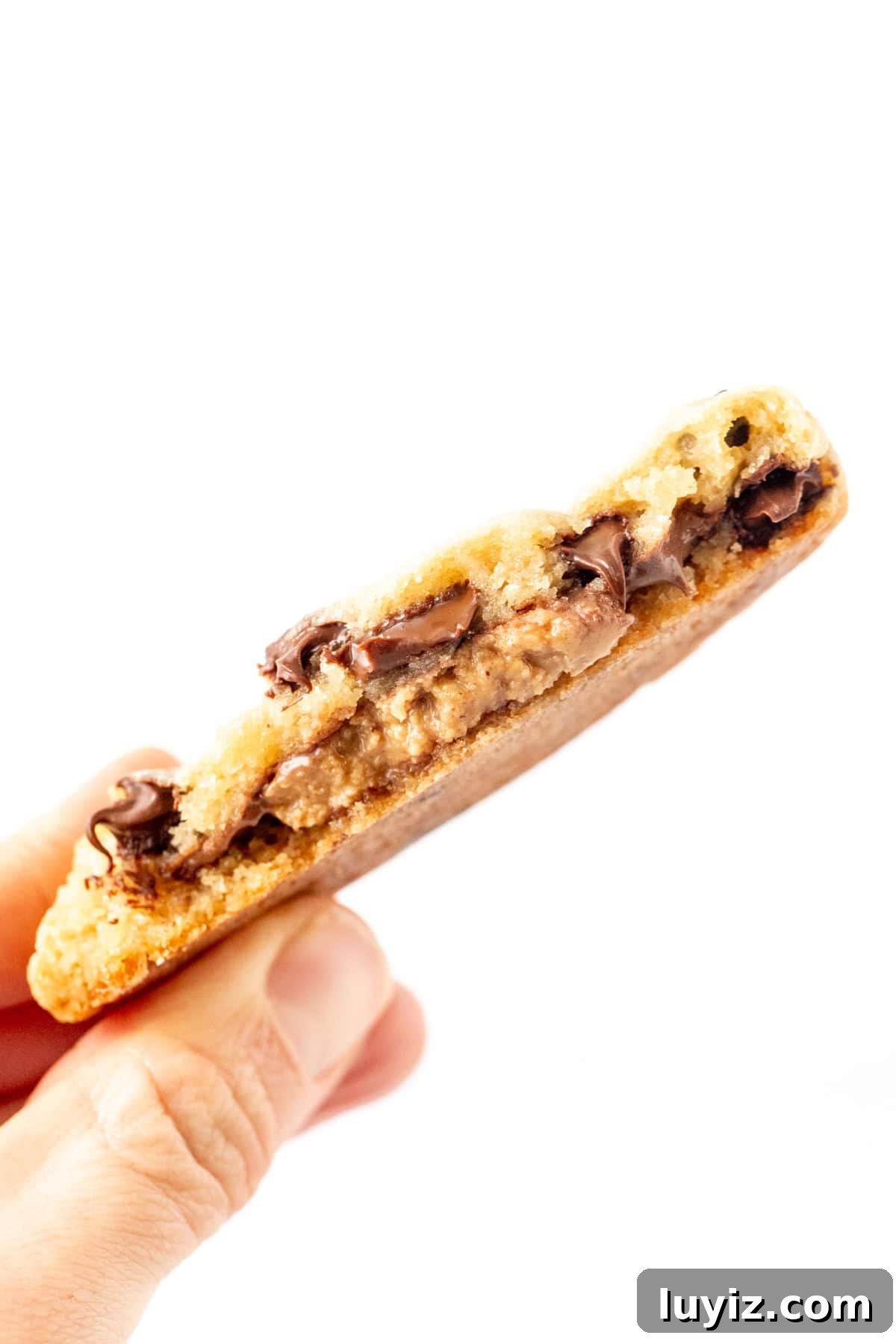 Reese’s Stuffed Chocolate Chip Cookies Recipe 4 Chocolate chip cookie, stuffed with a peanut butter cup and broken in half