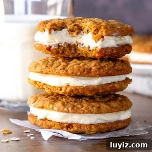 Three oatmeal cream pie cookies with a bite out of the top cookie