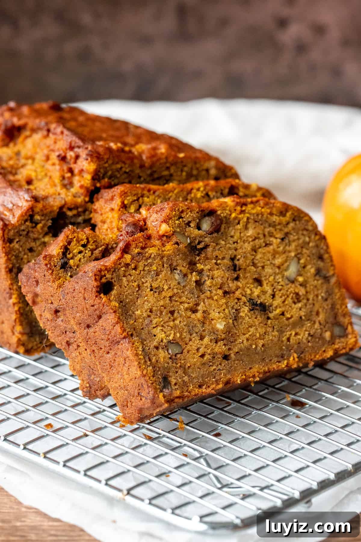 Moist Pumpkin Banana Bread Recipe for Fall Baking 2 Banana pumpkin bread with a few slices cut on cooling rack