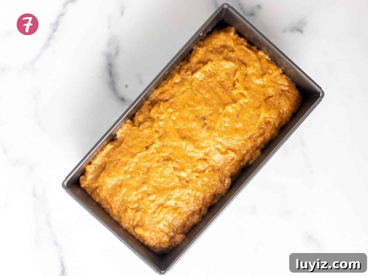 Moist Pumpkin Banana Bread Recipe for Fall Baking 6 Loaf pan of pumpkin banana bread batter