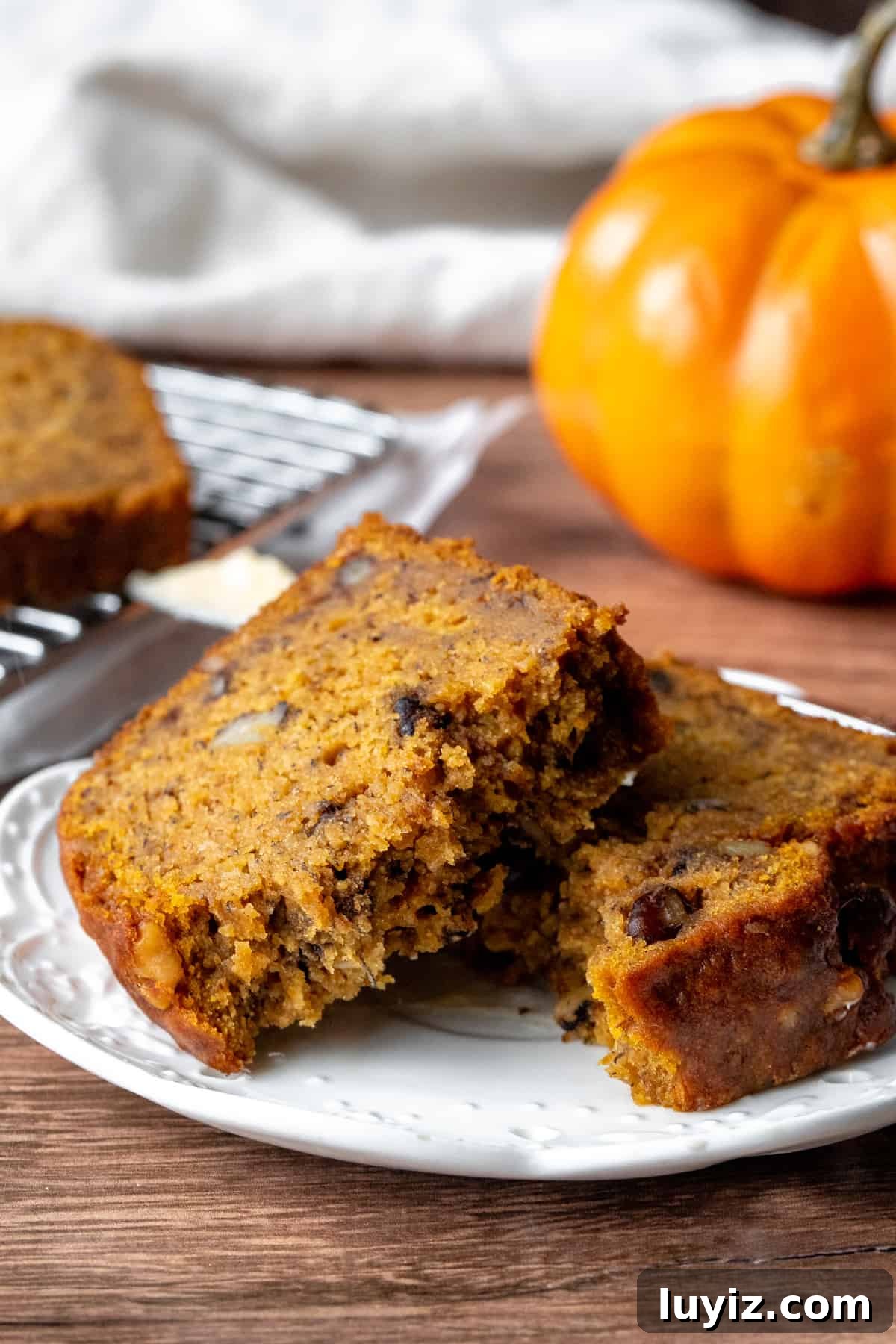 Moist Pumpkin Banana Bread Recipe for Fall Baking 8 Slice of pumpkin spice banana bread, broken in half