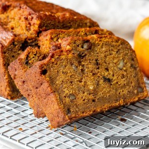 Moist Pumpkin Banana Bread Recipe for Fall Baking 9 Pumpkin banana loaf, with a few pieces sliced