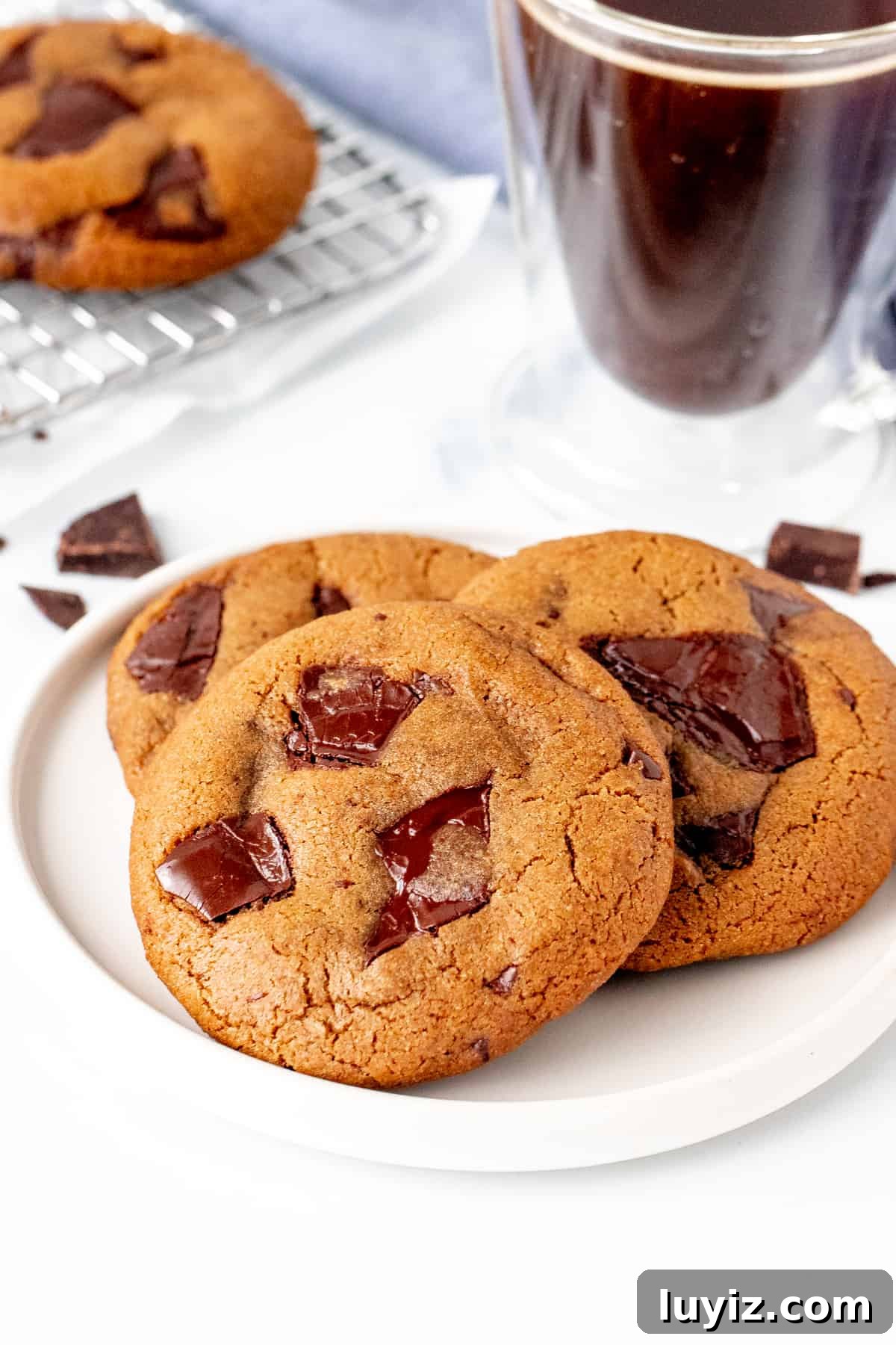 Espresso Chocolate Chip Cookie Recipe for Rich, Chewy Cookies 4 Plate of 3 espresso chocolate chunk cookies with cup of coffee