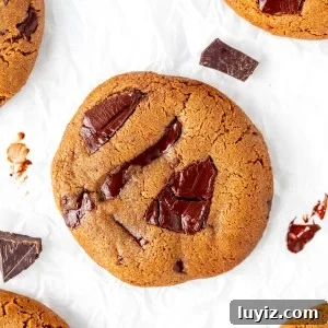 Espresso Chocolate Chip Cookie Recipe for Rich, Chewy Cookies 5 Coffee flavored cookies with chocolate chunks on baking paper