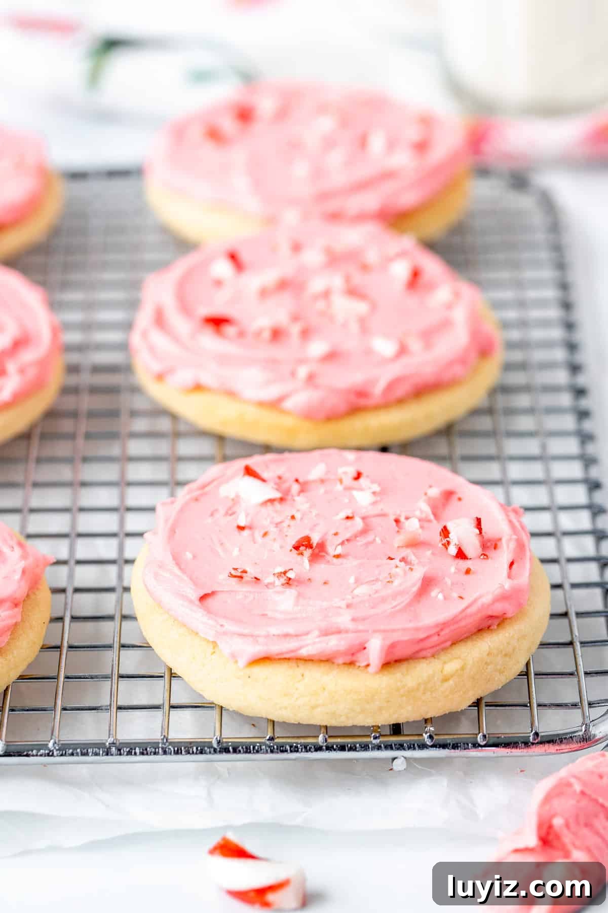 Peppermint Sugar Cookie Recipe: Crisp, Minty Holiday Cookies 4 Candy cane sugar cookies on a wire rack