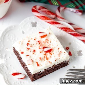 Brownie with white chocolate frosting and crushed candy canes on top