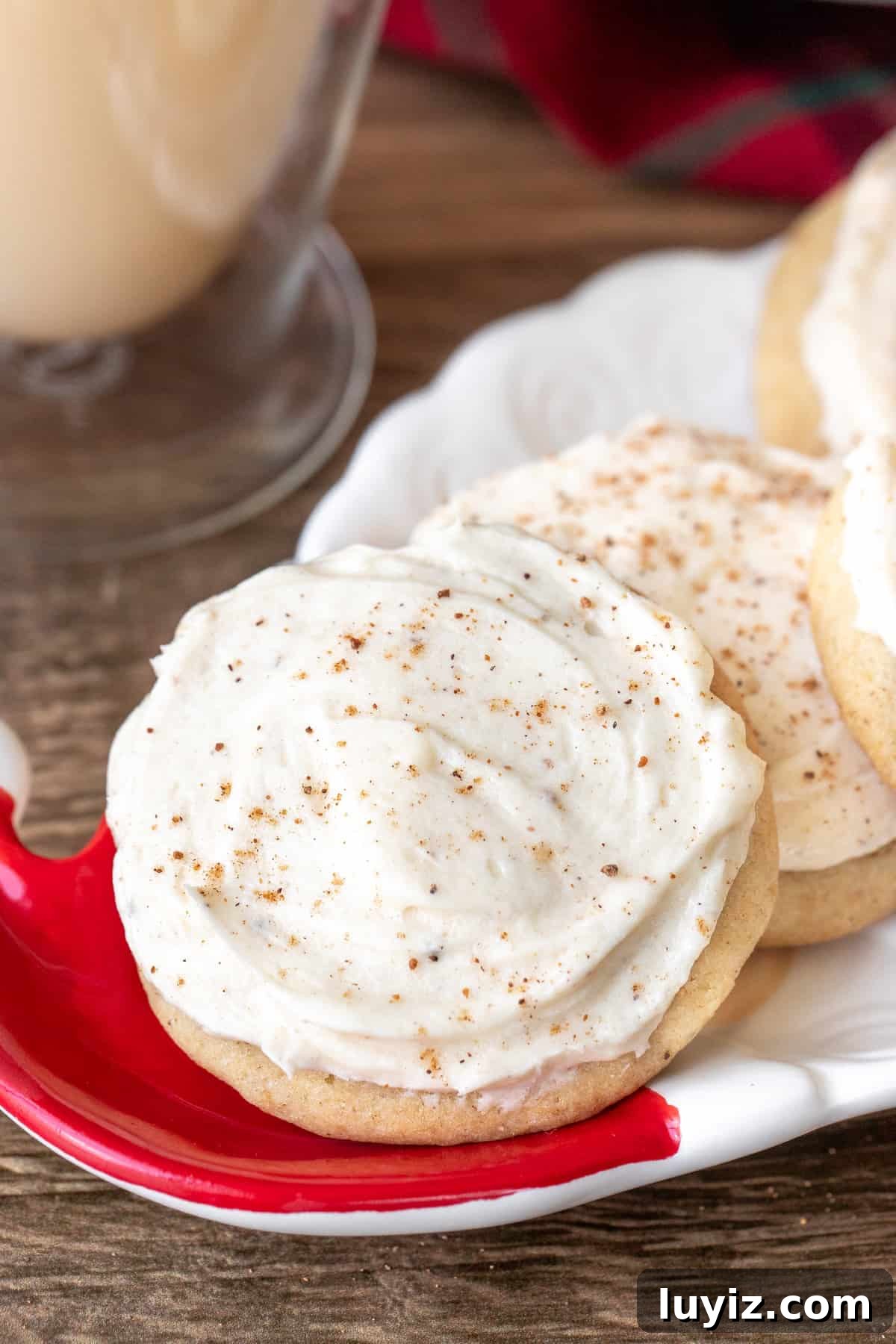 Eggnog Cookies with Creamy Eggnog Frosting — Holiday Cookie Recipe 2 Plate of eggnog cookies with eggnog frosting