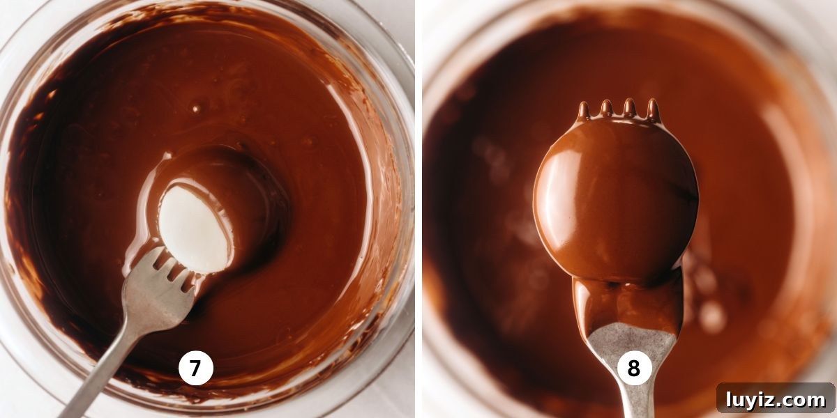 How to Make Classic Homemade Peppermint Patties at Home 7 Dipping peppermint patty rounds in melted chocolate in a glass bowl.