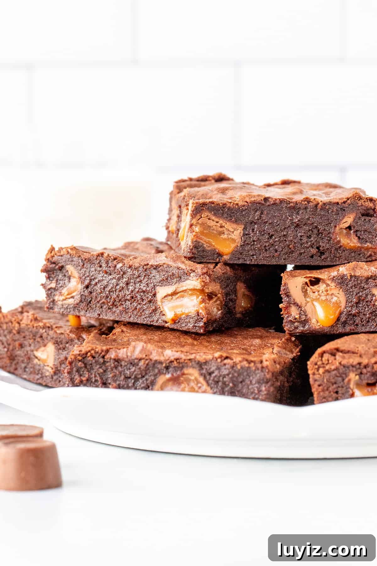 Decadent Rolo Brownies with Gooey Caramel Centers 3 Plate of brownies stuffed with Rolo candies