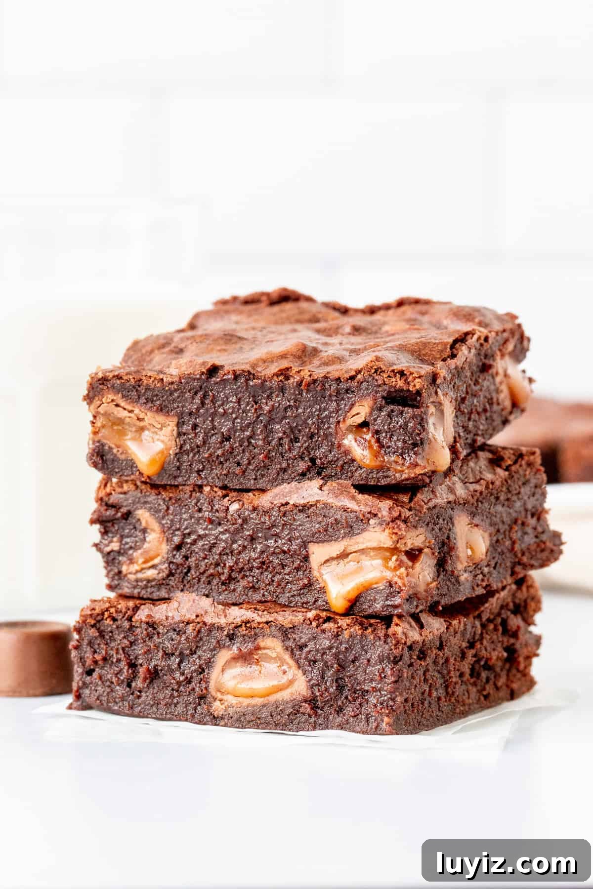 Decadent Rolo Brownies with Gooey Caramel Centers 4 Three brownies with pools of caramel