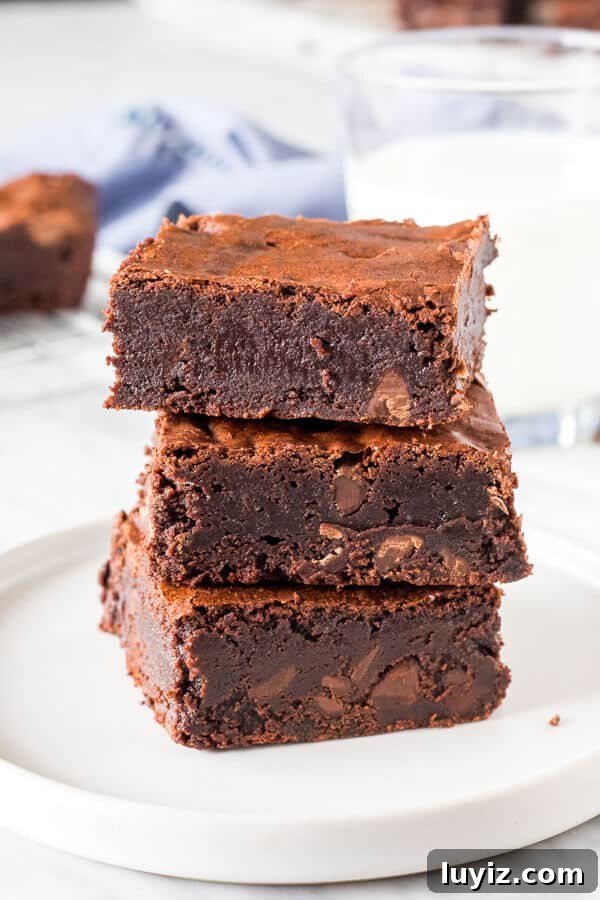 Mother’s Day Brunch & Dessert Ideas: Sweet Breakfast Recipes 13 A stack of 3 triple chocolate brownies from the side.