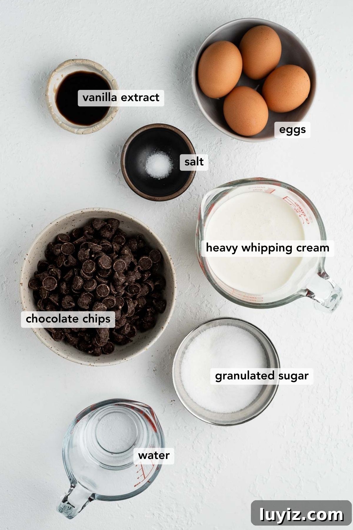 Blender Chocolate Mousse Recipe — Creamy No-Bake Dessert 3 Ingredients needed to make easy blender chocolate mousse on white textured background.