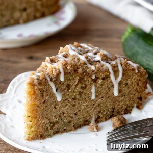Slice of zucchini coffee cake on a plate