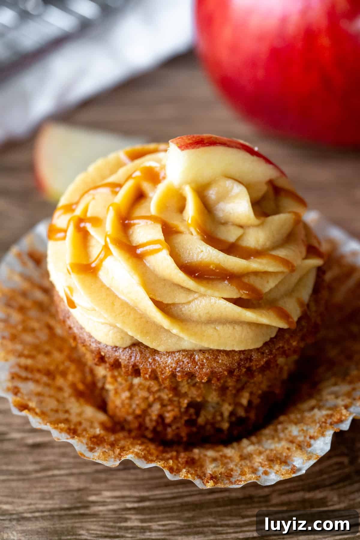 Caramel Apple Cupcakes with Brown Butter Streusel 2 Caramel apple cupcake with muffin paper peeled back.