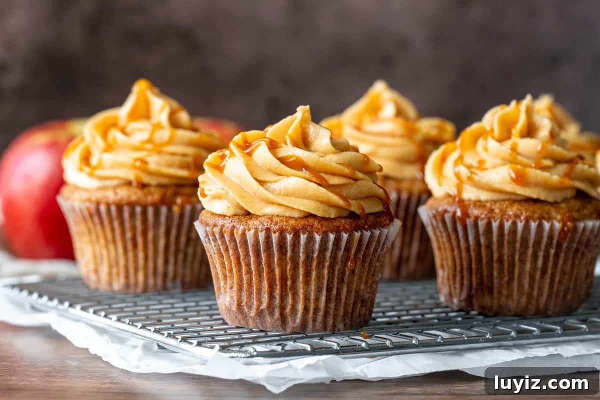 Caramel Apple Cupcakes with Brown Butter Streusel 5 Wire rack with apple cupcakes with caramel frosting.