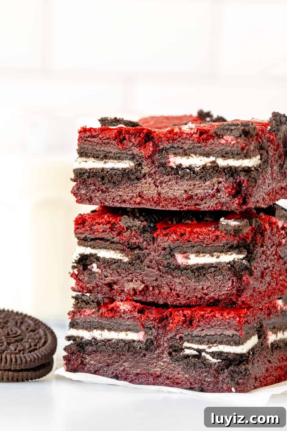 Red Velvet Brownie Bars Stuffed with Oreo Cookies 2 Stack of three Oreo stuffed red velvet brownies