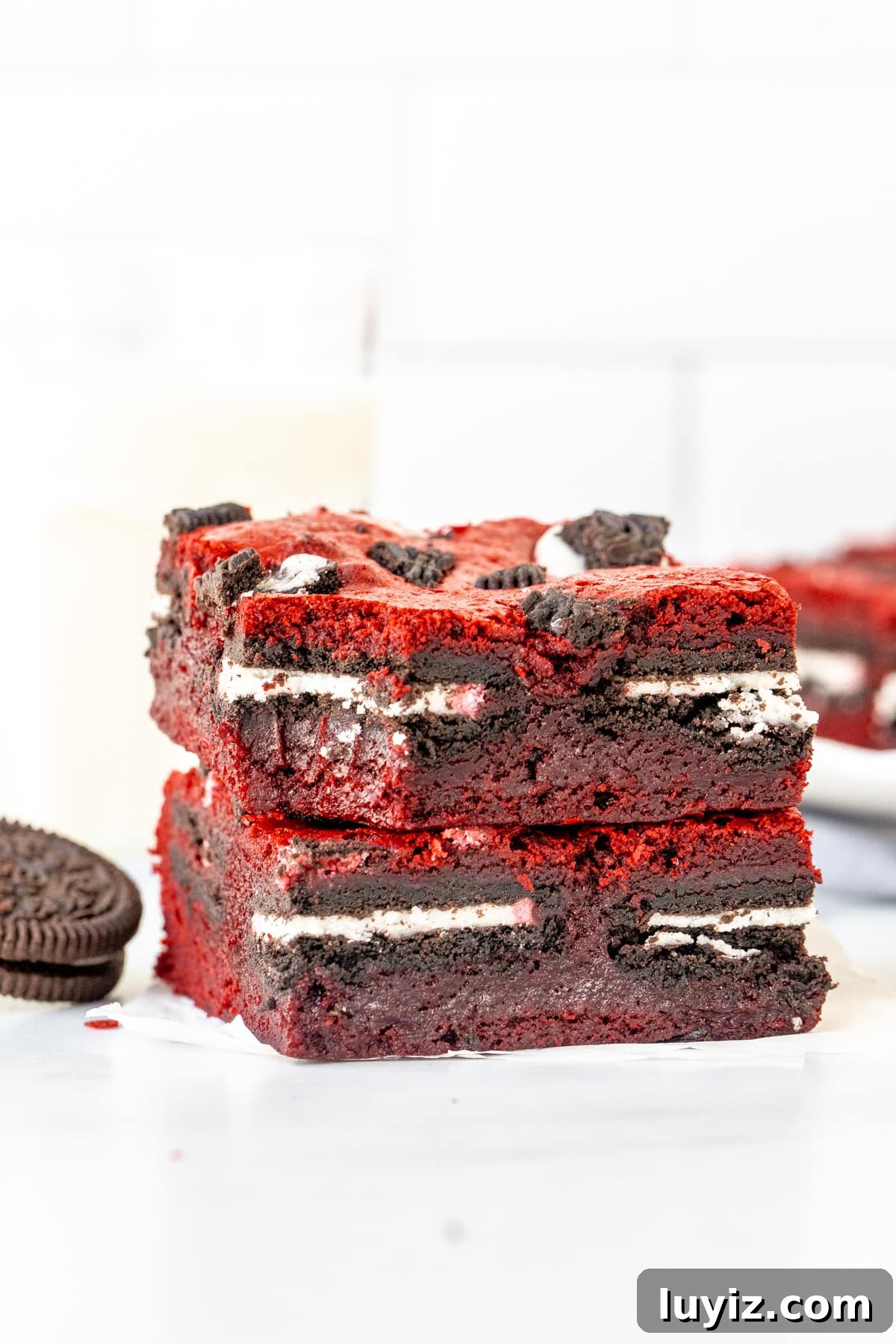 Red Velvet Brownie Bars Stuffed with Oreo Cookies 6 Stack of 2 Oreo red velvet brownies, with a bite taken out of the top brownie