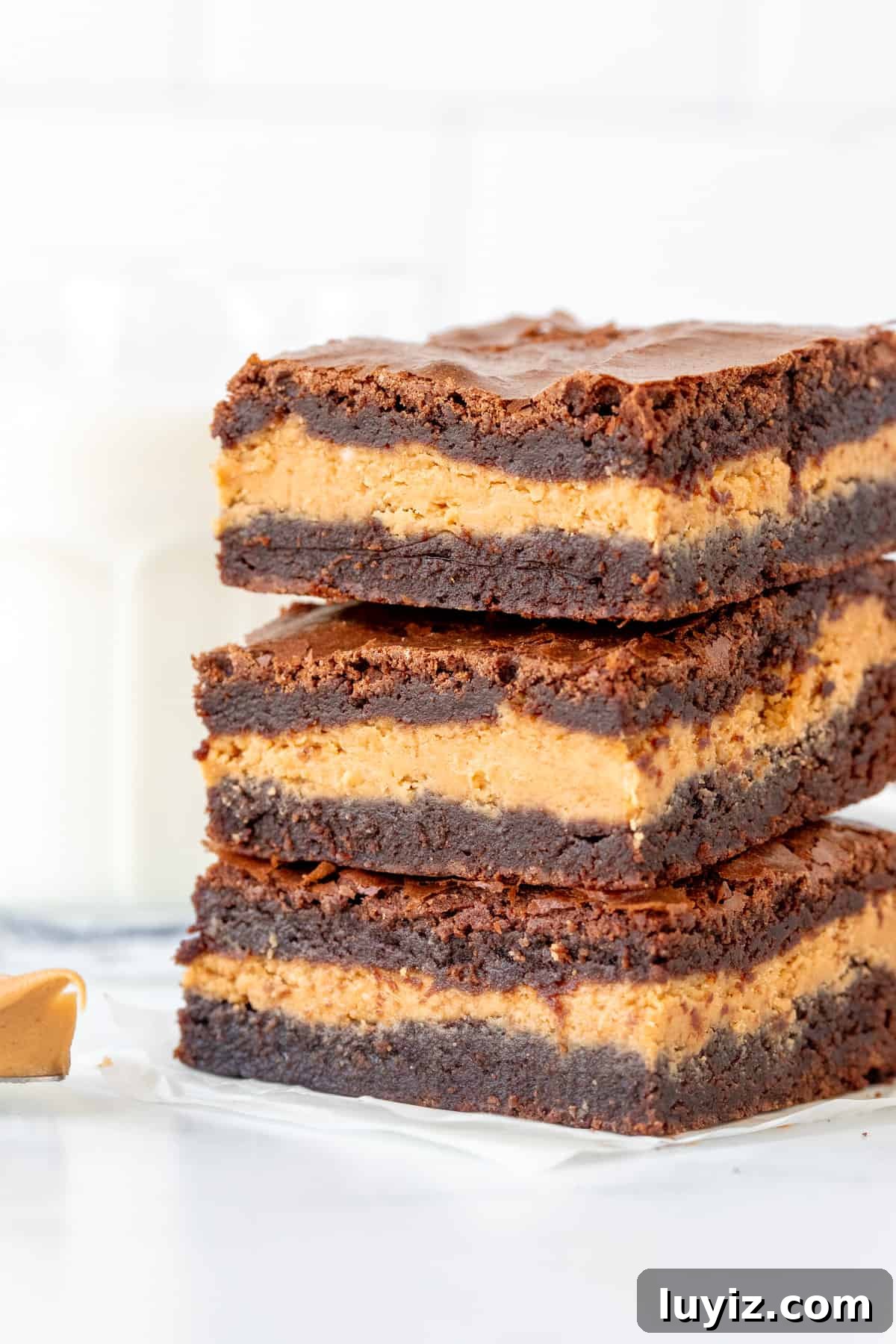 Decadent Peanut Butter-Stuffed Brownies Recipe 8 Three peanut butter stuffed brownies, one on top of each other