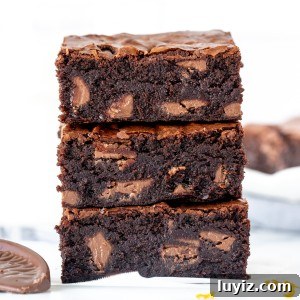 Decadent Chocolate Orange Brownies with Zesty Citrus Glaze 9 Stack of three chocolate orange brownies, one on top of each other