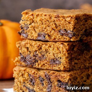 Pumpkin Chocolate Chip Blondies: Soft Fall Dessert Bars 8 Stack of three pumpkin chocolate chip bars